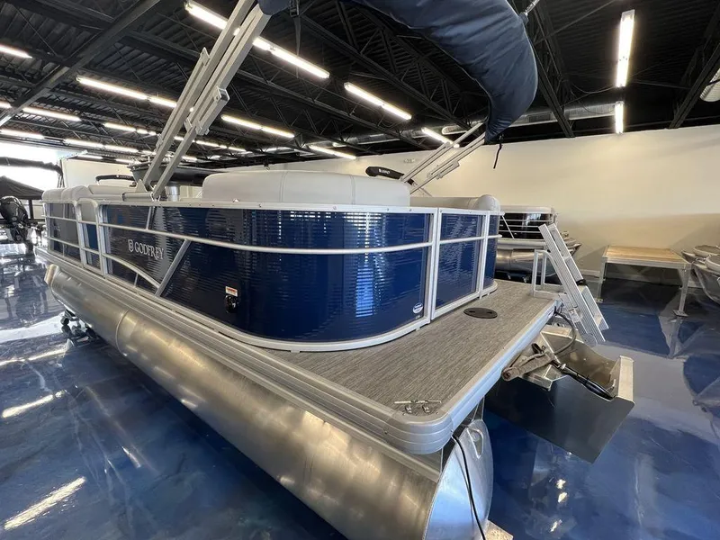 Slide: The Image of 2023 Godfrey SW 2286 MT pontoon boat in showroom. - 2