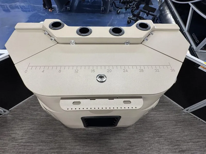 Slide: The Image of 2023 Godfrey SW 2286 FS boat console with cup holders and measurement markings. - 11