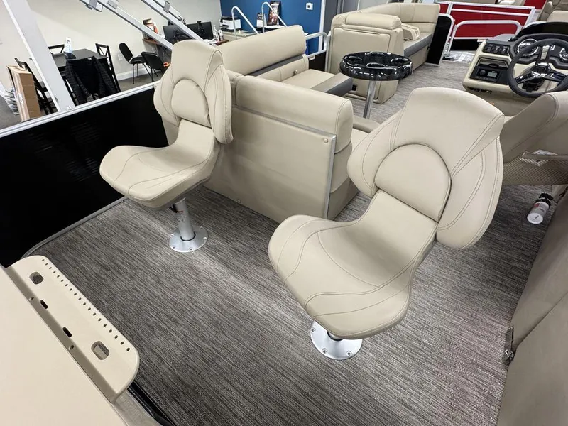 Slide: The Image of 2023 Godfrey SW 2286 FS boat interior with beige seating and modern design. - 12