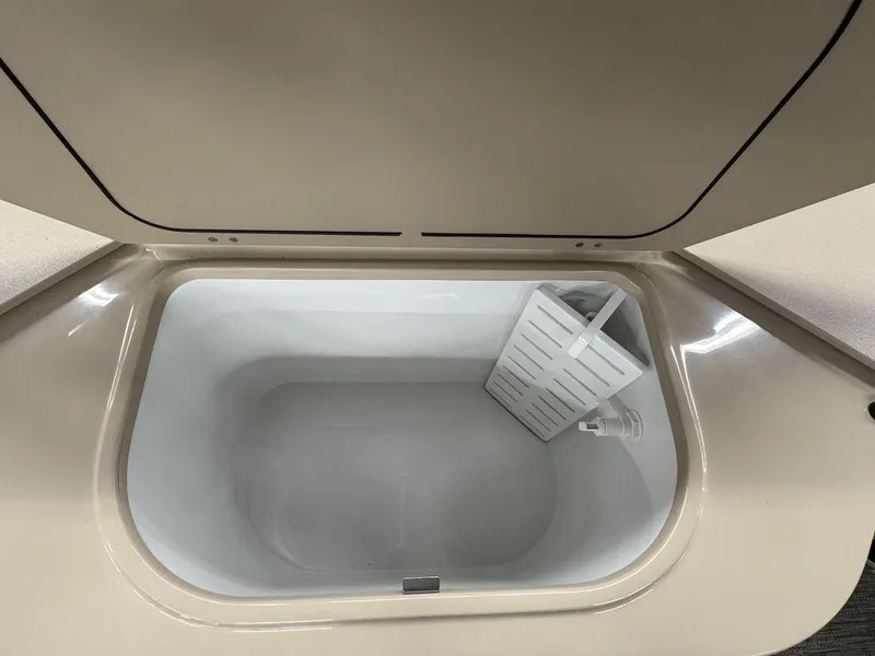 Slide: The Image of Open storage compartment in 2023 Godfrey SW 2286 FS boat. - 14