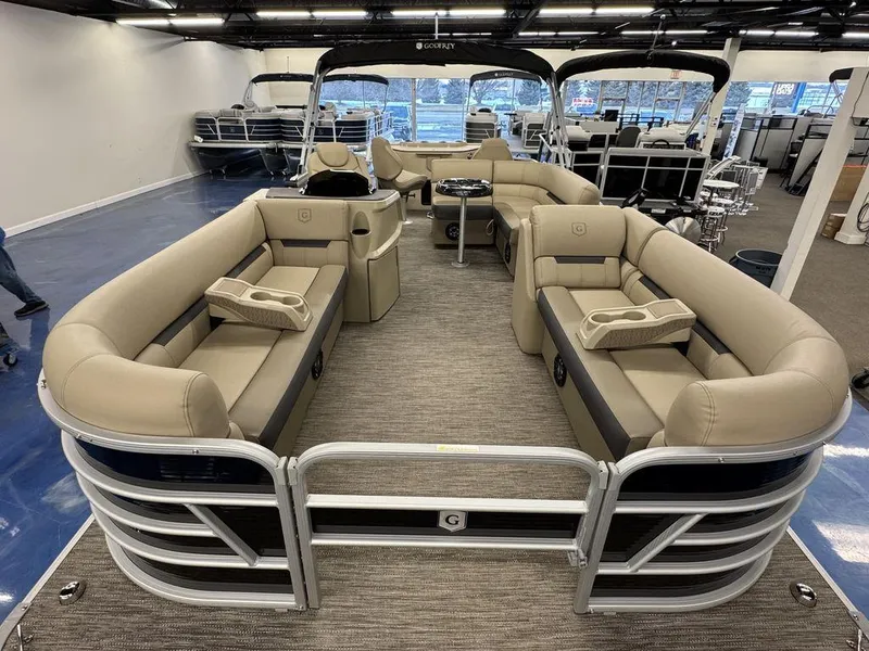Slide: The Image of 2023 Godfrey SW 2286 FS pontoon boat with beige seating in showroom. - 6