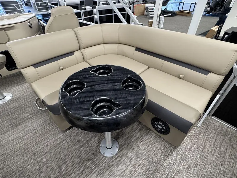 Slide: The Image of Luxurious seating area on 2023 Godfrey SW 2286 FS boat with stylish table and cup holders. - 7