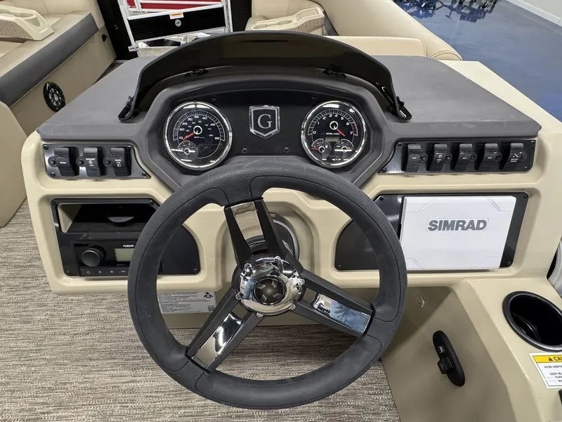 Slide: The Image of Dashboard of 2023 Godfrey SW 2286 FS boat with steering wheel and Simrad display. - 9