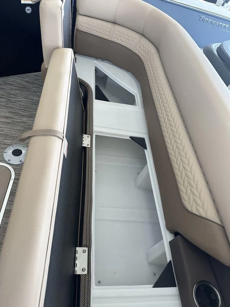 Slide: The Image of 2023 Godfrey MC 255 SFL boat with open under-seat storage compartment. - 10