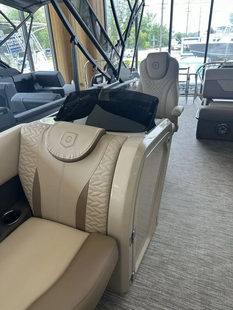 Slide: The Image of Interior of 2023 Godfrey MC 255 SFL boat with luxurious seating and modern design. - 11