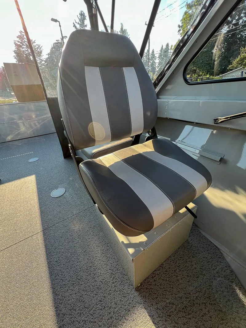 Slide: The Image of 2024 Hewescraft 200 Pro-V interior seat with sunlight streaming through windows. - 10