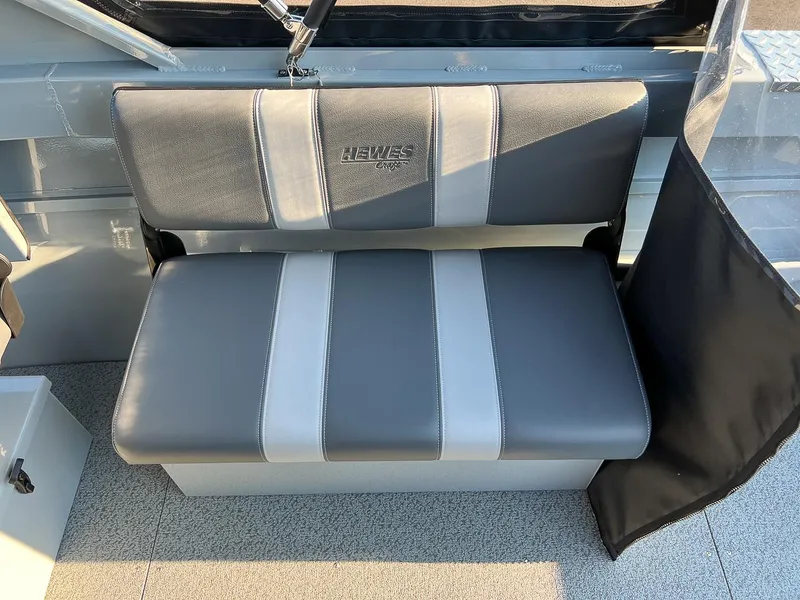Slide: The Image of 2024 Hewescraft 200 Pro-V boat seat with grey and white upholstery. - 12