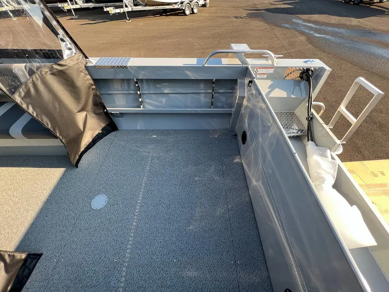 Slide: The Image of 2024 Hewescraft 200 Pro-V boat interior, showing spacious deck and storage compartments. - 15
