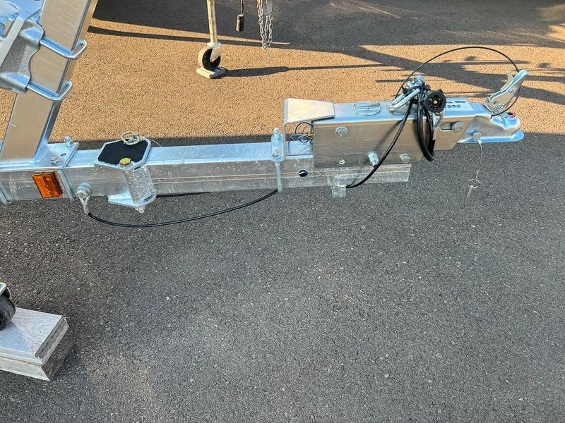 Slide: The Image of Close-up of a 2024 Hewescraft 200 Pro-V boat trailer hitch and coupler. - 16