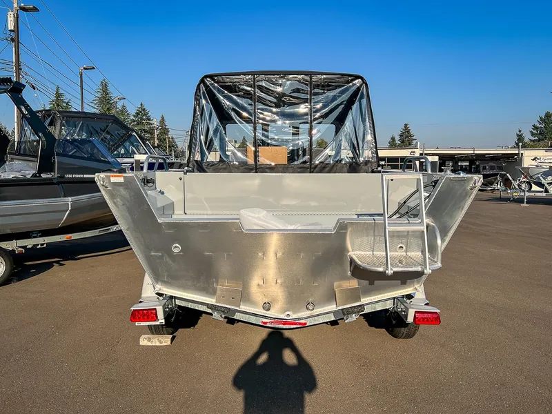 Slide: The Image of 2024 Hewescraft 200 Pro-V boat, rear view, in a dealership lot. - 4