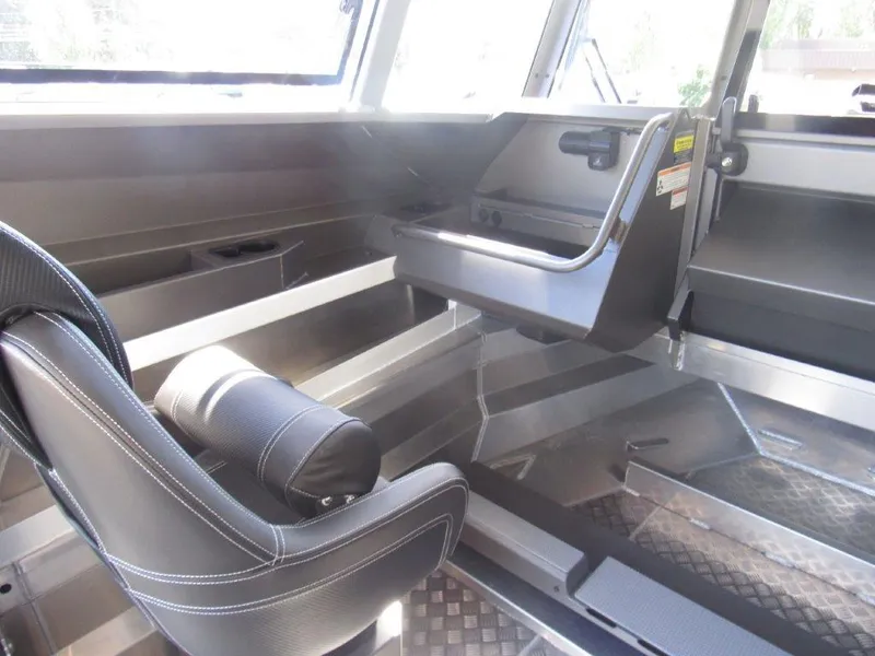 Slide: The Image of Interior of 2022 Stabicraft 2250 UltraCab WT, featuring seating and storage compartments. - 13