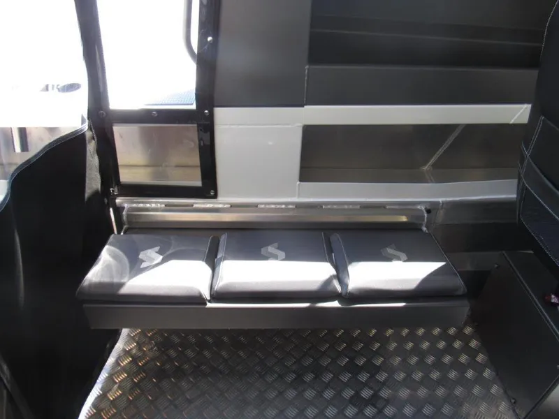 Slide: The Image of Interior seating of 2022 Stabicraft 2250 UltraCab WT boat with cushioned bench and diamond plate flooring. - 15