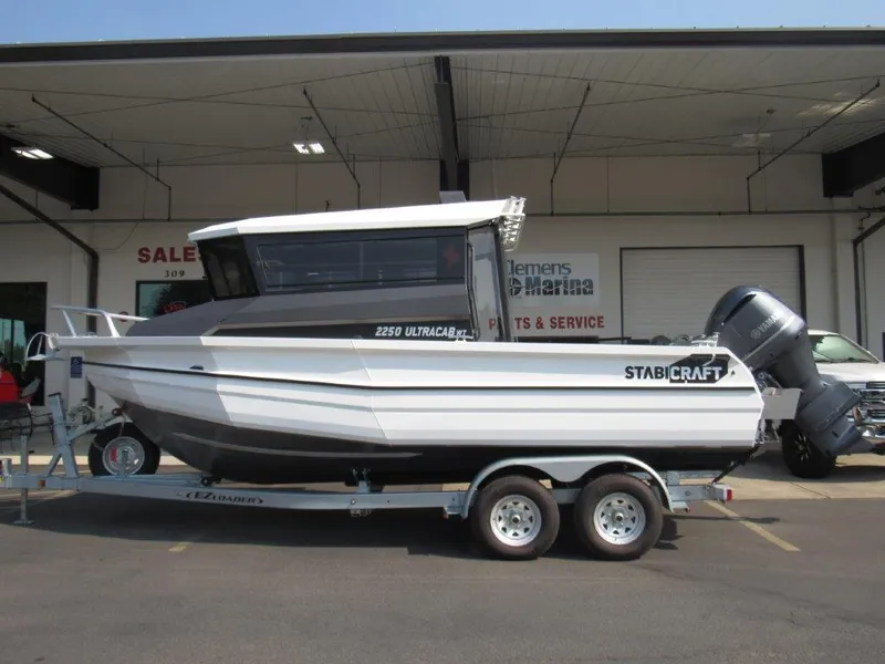 Slide: The Image of 2022 Stabicraft 2250 UltraCab WT boat on trailer at marina dealership. - 2