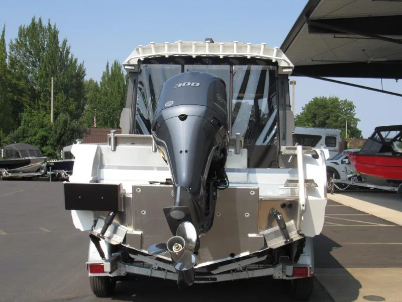 Slide: The Image of 2022 Stabicraft 2250 UltraCab WT boat with powerful outboard motor, parked outdoors. - 4