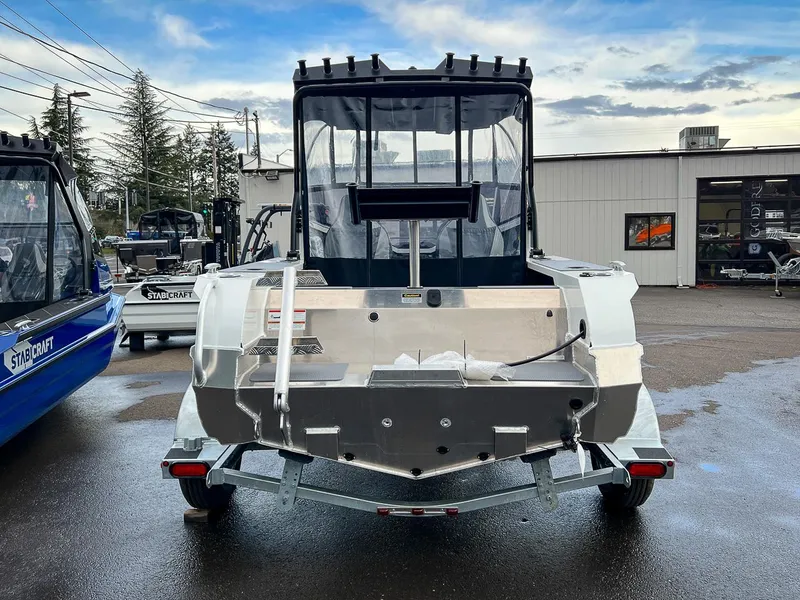 Slide: The Image of 2024 Stabicraft 1550 Fisher boat on trailer, rear view, outdoor dealership. - 4