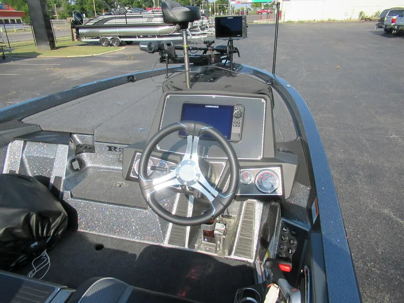 Slide: The Image of 2023 Ranger Z519 boat dashboard with steering wheel and navigation system. - 3