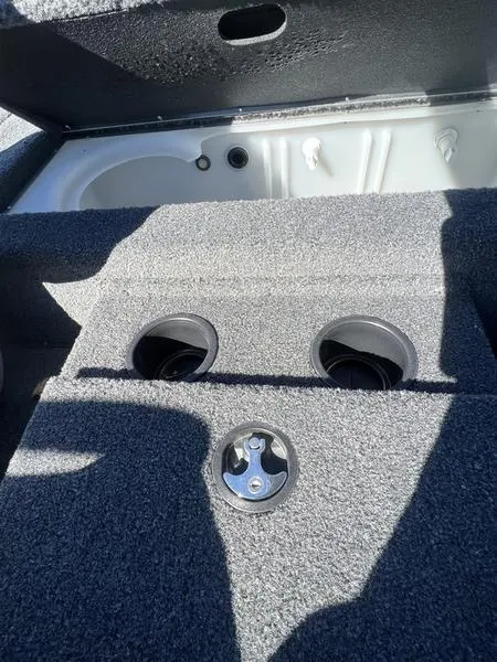 Slide: The Image of 2023 Crestliner XF 179 boat storage compartment with cup holders. - 11