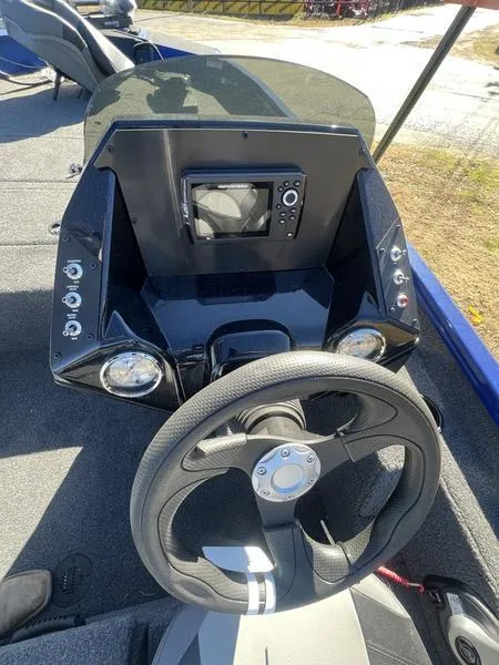 Slide: The Image of 2023 Crestliner XF 179 boat dashboard with steering wheel and control panel. - 6