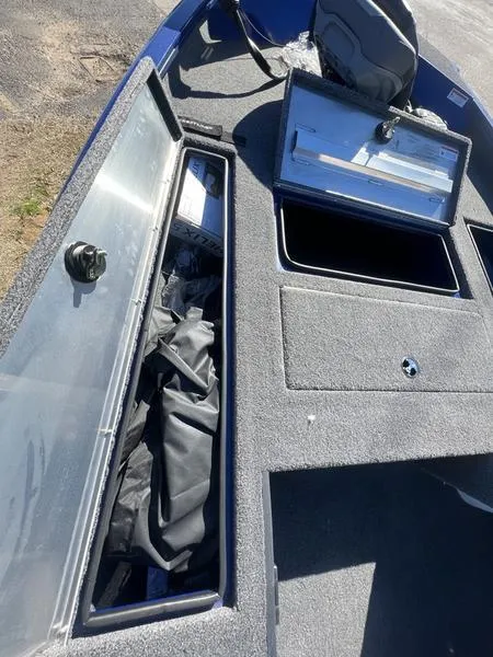 Slide: The Image of 2023 Crestliner XF 179 boat storage compartments and deck view. - 7