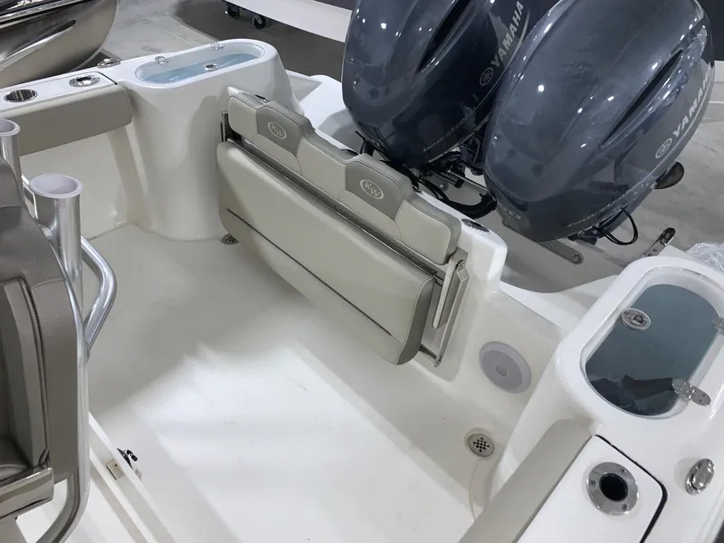 Slide: The Image of 2024 Key West 244 Center Console boat with Yamaha engines and foldable seating. - 14