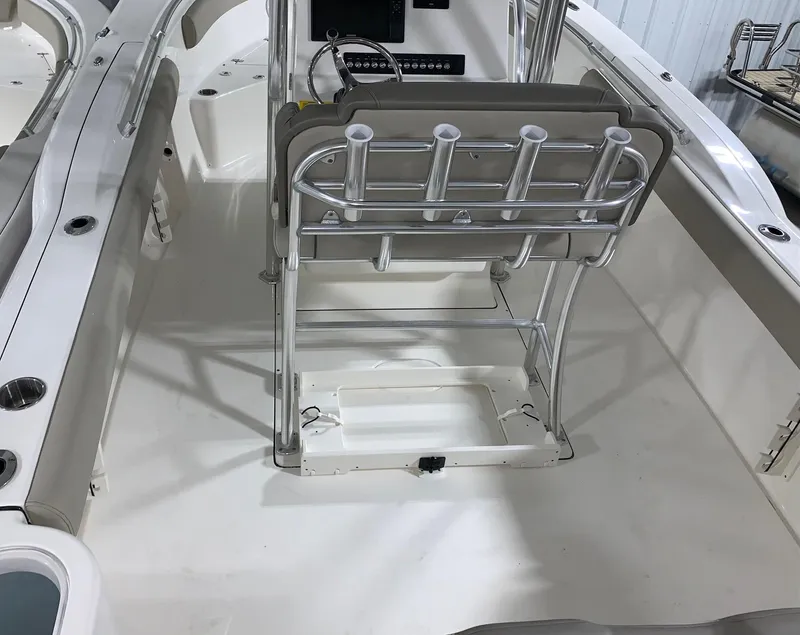Slide: The Image of 2024 Key West 244 Center Console boat interior with rod holders and seating. - 4