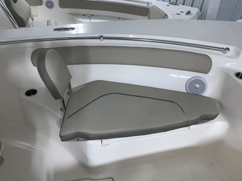 Slide: The Image of 2024 Key West 244 Center Console boat with cushioned seating and built-in speaker. - 6