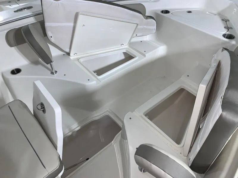 Slide: The Image of 2024 Key West 244 Center Console boat interior with open storage compartments. - 7