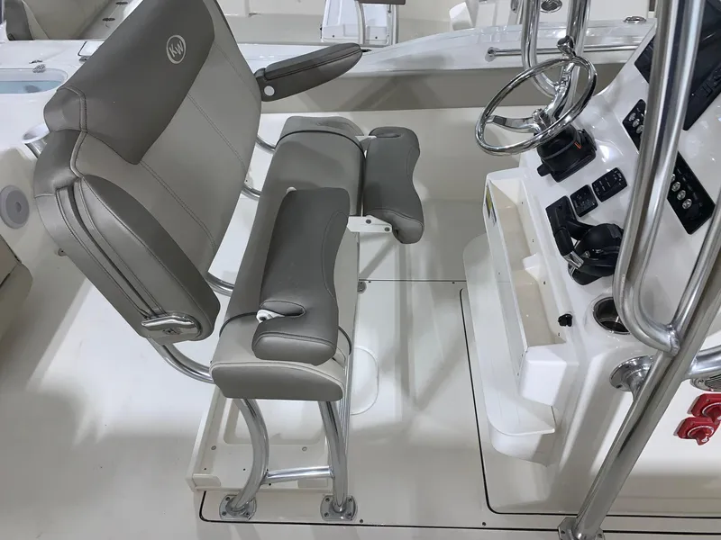 Slide: The Image of 2024 Key West 244 CC Manta Gray boat interior with helm seat and console. - 10