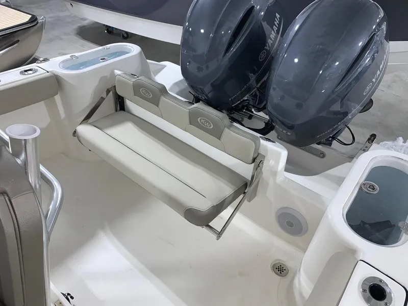 Slide: The Image of 2024 Key West 244 CC Manta Gray boat with dual engines and foldable seating. - 15