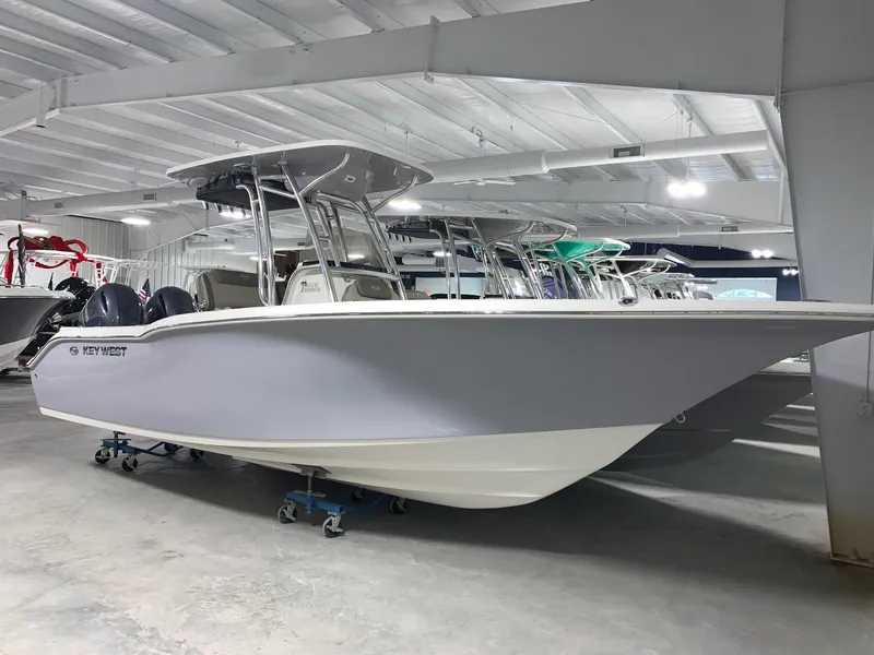 Slide: The Image of 2024 Key West 244 CC Manta Gray boat in showroom. - 2