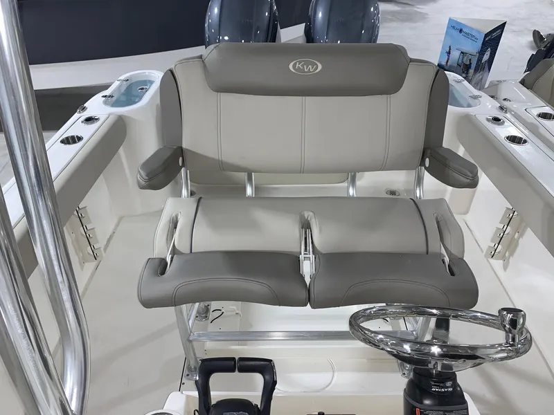 Slide: The Image of 2024 Key West 244 CC Manta Gray boat interior with dual seating and steering wheel. - 9
