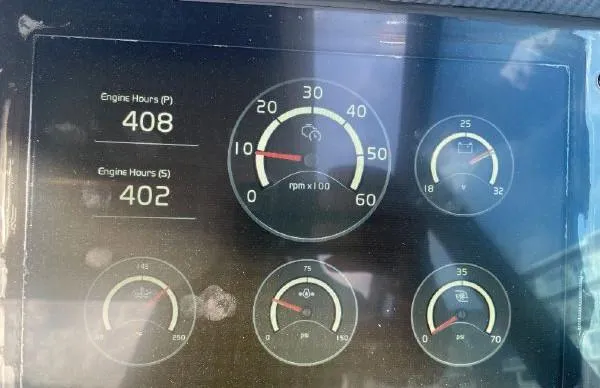 Slide: The Image of Dashboard of a 2017 Evo Yachts 43 showing engine hours and gauges. - 11