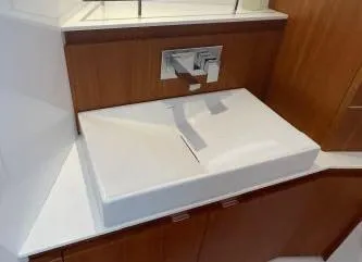 Slide: The Image of Modern bathroom sink in 2017 Evo Yachts 43, featuring sleek design and wooden cabinetry. - 17