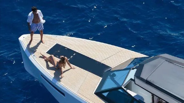 Slide: The Image of 2017 Evo Yachts 43 model with people relaxing on deck in blue ocean. - 2