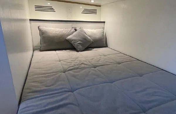 Slide: The Image of Cozy bedroom in a 2017 Evo Yachts 43 with gray bedding and pillows. - 20