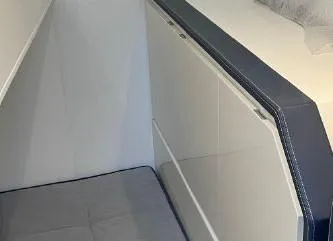 Slide: The Image of Interior cabin of 2017 Evo Yachts 43 with modern design and cushioned seating. - 22