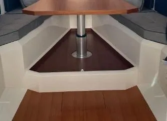 Slide: The Image of Interior seating area of 2017 Evo Yachts 43 with wooden table and cushioned seats. - 23