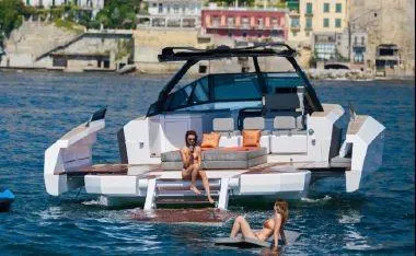 Slide: The Image of 2017 Evo Yachts 43 luxury yacht with people relaxing on water and deck. - 31
