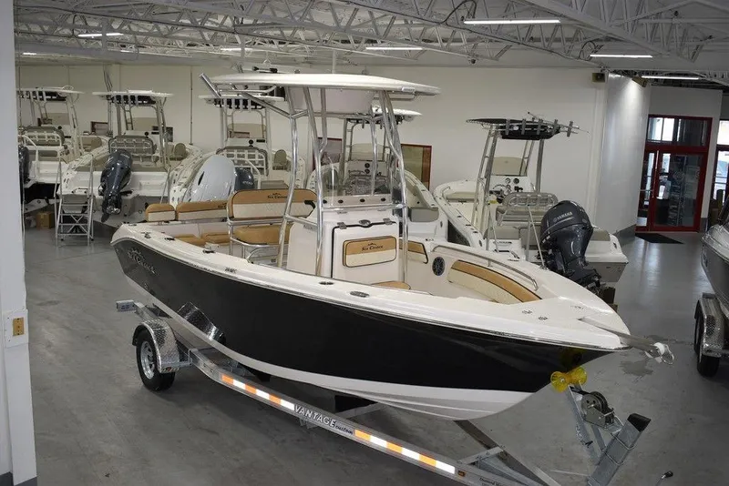 Slide: The Image of 2023 Sea Chaser 20 HFC boat on a trailer in a showroom. - 0