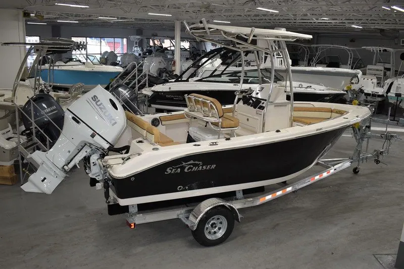 Slide: The Image of 2023 Sea Chaser 20 HFC boat on trailer in showroom. - 1