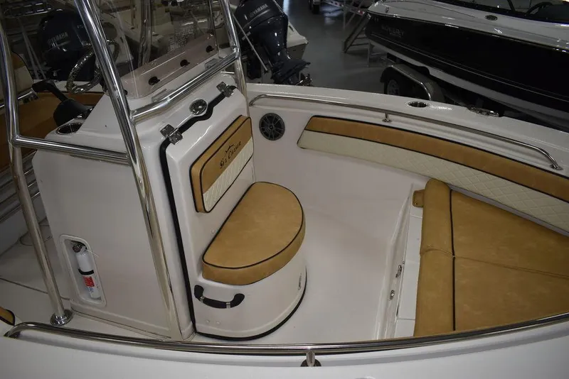Slide: The Image of 2023 Sea Chaser 20 HFC boat interior with tan seating and stainless steel accents. - 13