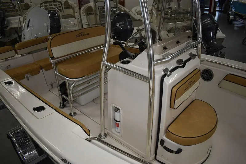 Slide: The Image of 2023 Sea Chaser 20 HFC boat interior with tan seating and stainless steel fixtures. - 14