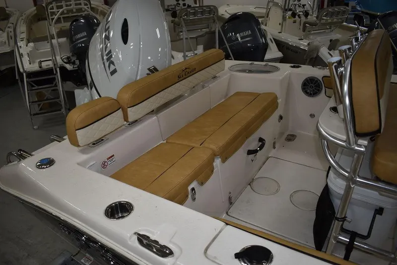 Slide: The Image of 2023 Sea Chaser 20 HFC boat interior with tan seating and Yamaha outboard motor. - 16