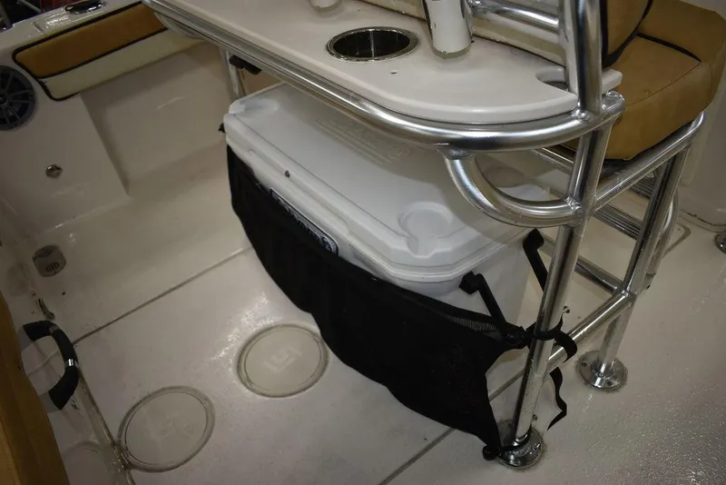 Slide: The Image of 2023 Sea Chaser 20 HFC boat interior with cooler storage and seating. - 23