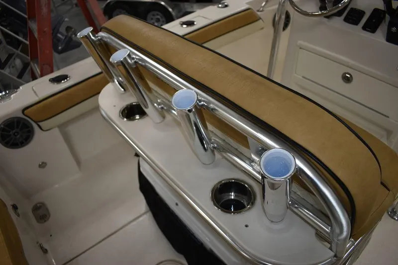 Slide: The Image of 2023 Sea Chaser 20 HFC boat interior with rod holders and cushioned seating. - 24