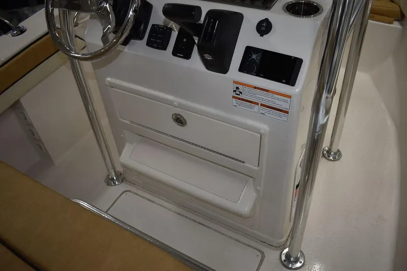 Slide: The Image of 2023 Sea Chaser 20 HFC boat console with steering wheel and control panel. - 29