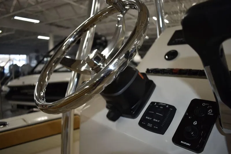 Slide: The Image of Close-up of the 2023 Sea Chaser 20 HFC boat's steering wheel and control panel. - 31