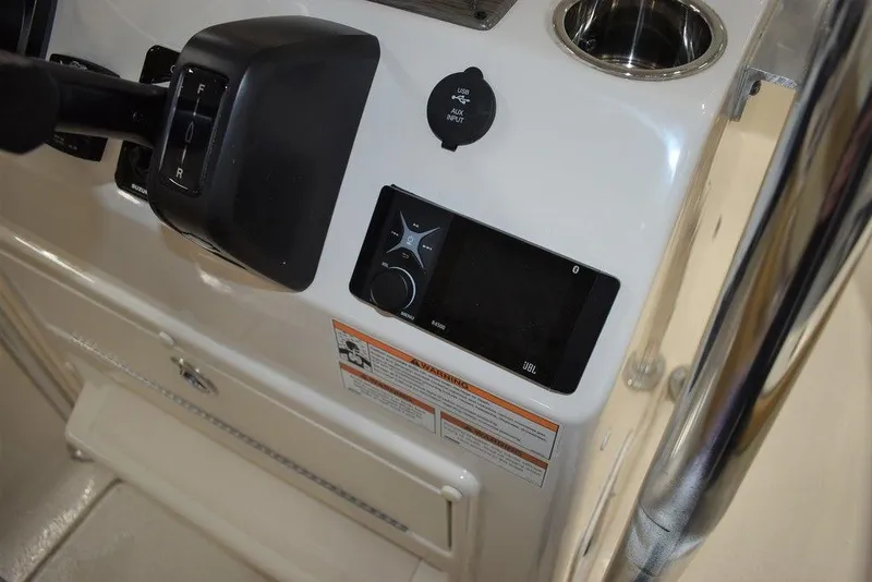 Slide: The Image of 2023 Sea Chaser 20 HFC boat console with controls and display. - 32