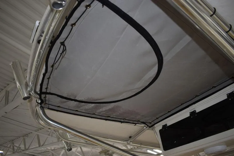 Slide: The Image of 2023 Sea Chaser 20 HFC boat T-top with rod holders and storage net. - 38