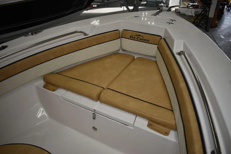 Slide: The Image of 2023 Sea Chaser 20 HFC boat with tan cushioned seating in the bow area. - 39